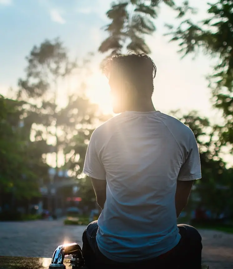 man sitting on road